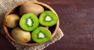 Kiwi Fruit On Wooden