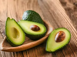 Avocado On Old Wooden Table