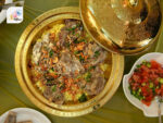 Jordanian Dishes Mansaf Garnished with Almonds